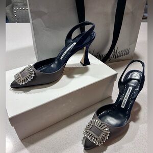 Manolo Blahnik silver and navy pointed toe sling backs with broach. Size 37.5.